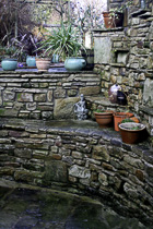 [ photo: Garden Stones & Pots in Wray, Lancashire, England UK, January 2007 (img 118-046) ]