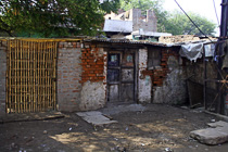 [ photo: Kashi Streets, Door, Bricks and Bamboo, Varanasi, Uttar Pradesh, India, February 2010 (img 197-051) ]